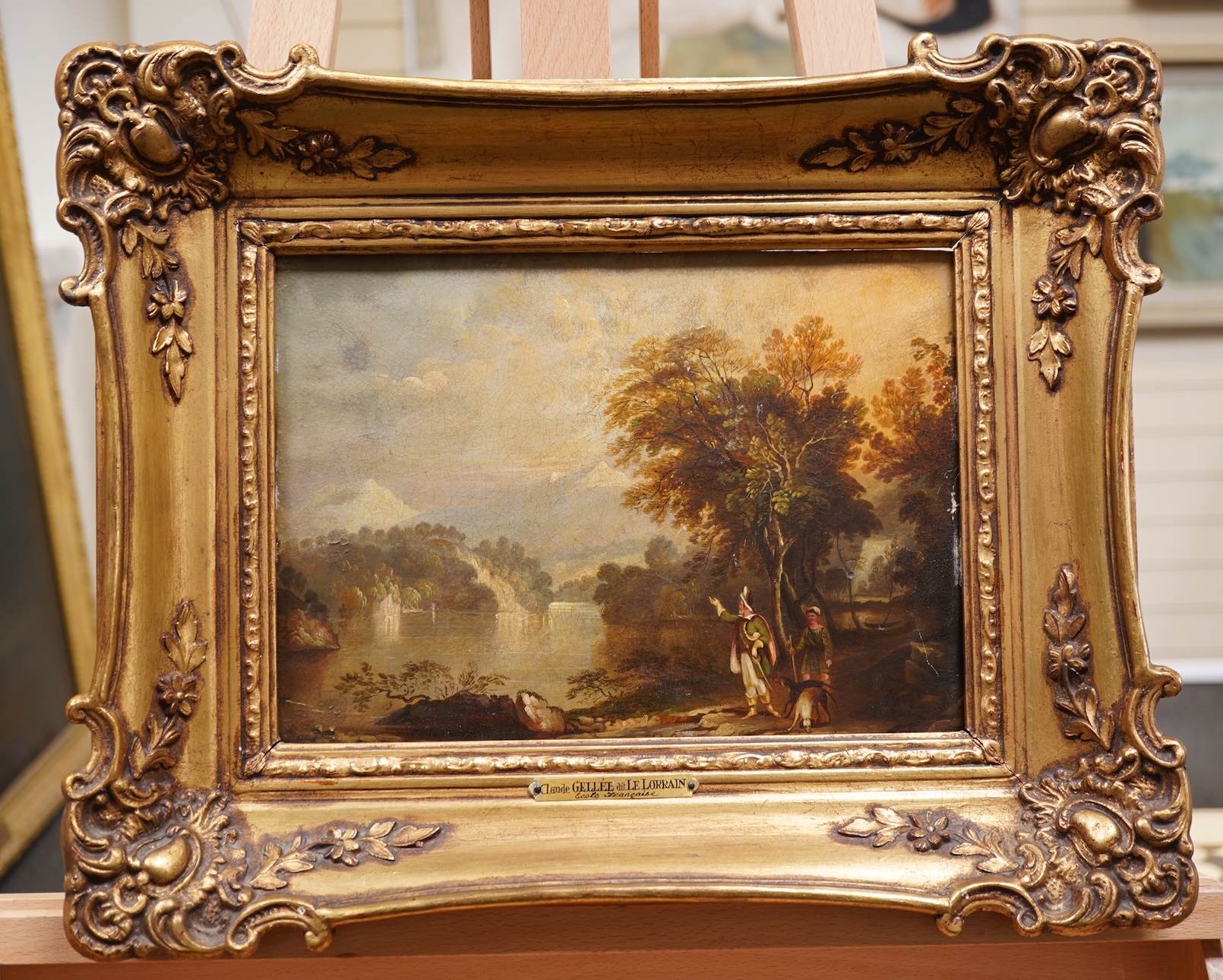 Attributed to Claude Gellée called Le Lorrain, French (1600-1682), Lakeland landscape with figures and dogs to the foreground